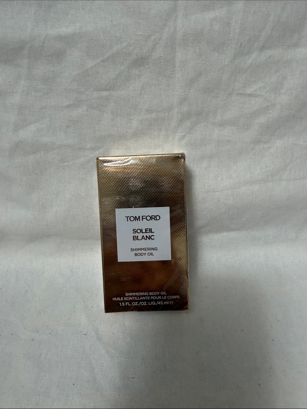 Tom Ford Shimmering Body Oil in Metallic Gold Packaging
